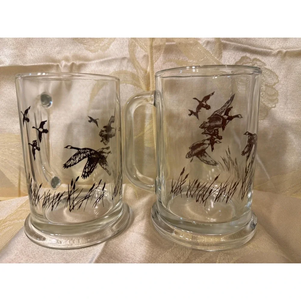 VTG AVON 1982 TANKARD MUGS STEIN CLEAR  GLASS WITH FLYING DUCKS/GEESE  Set Of 2